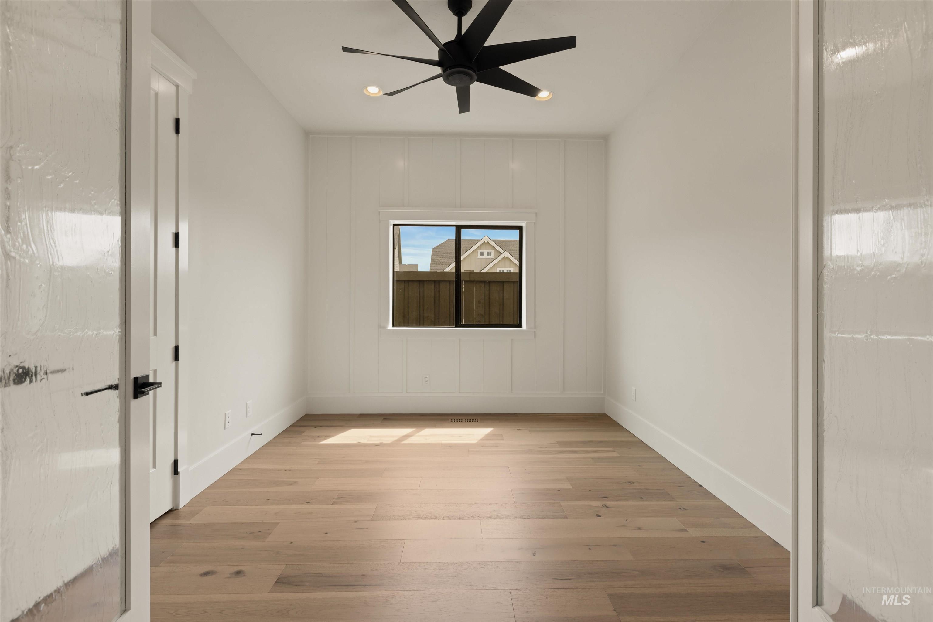 2595 East Tenzing Drive Meridian, ID 83642 - Photo 30 of 32 Unfurnished room with light wood finished floors and a ceiling fan