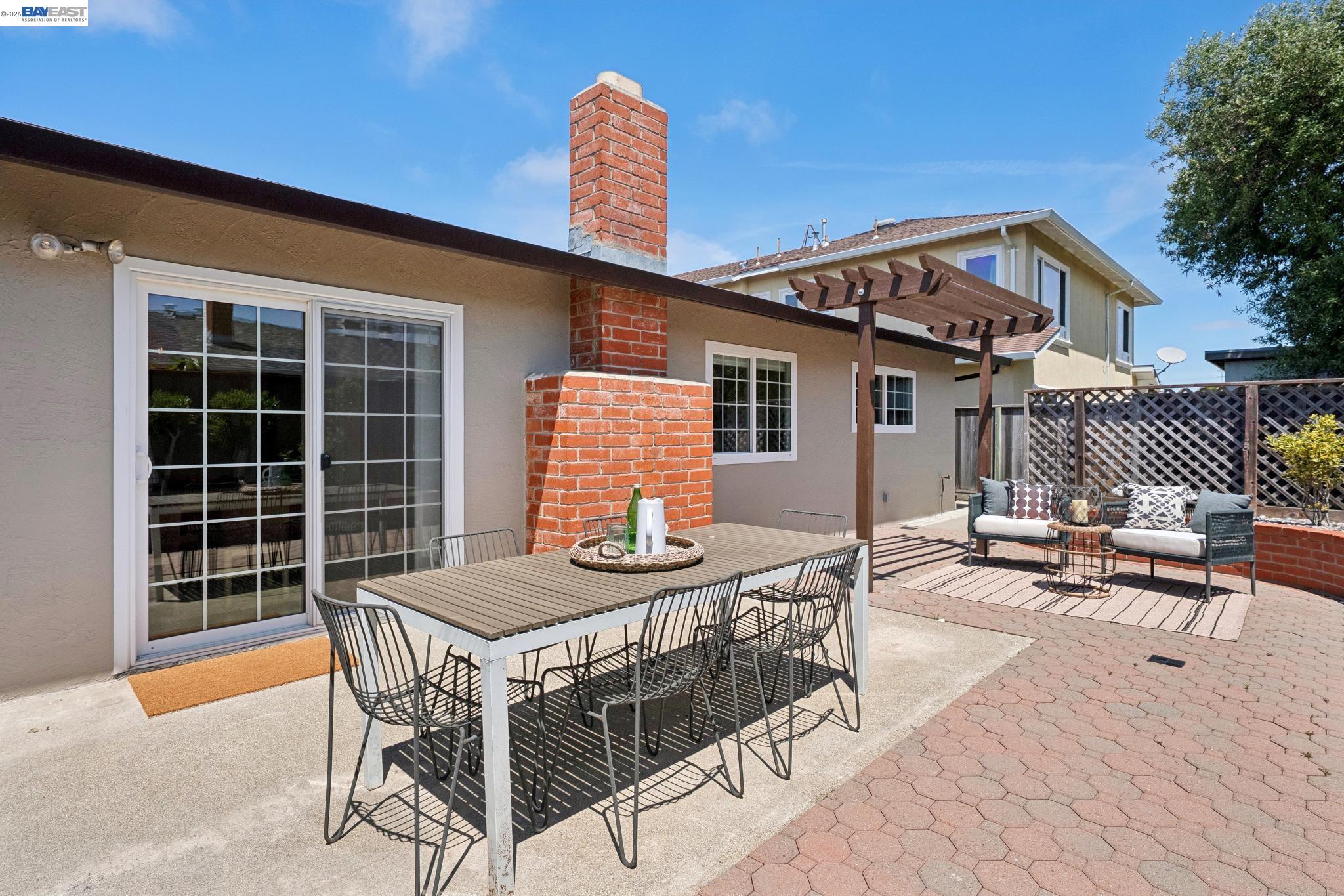 328 Sand Beach Road Alameda, CA 94501 - Photo 44 of 48 a table and chairs in front of a house
