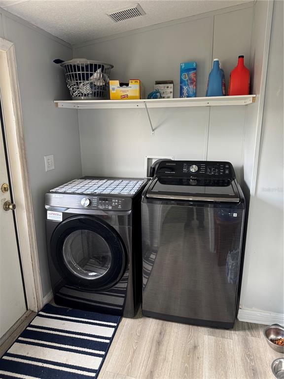 18806 Monroe Avenue Orlando, FL 32820 - Photo 14 of 44 a utility room with dryer and washer