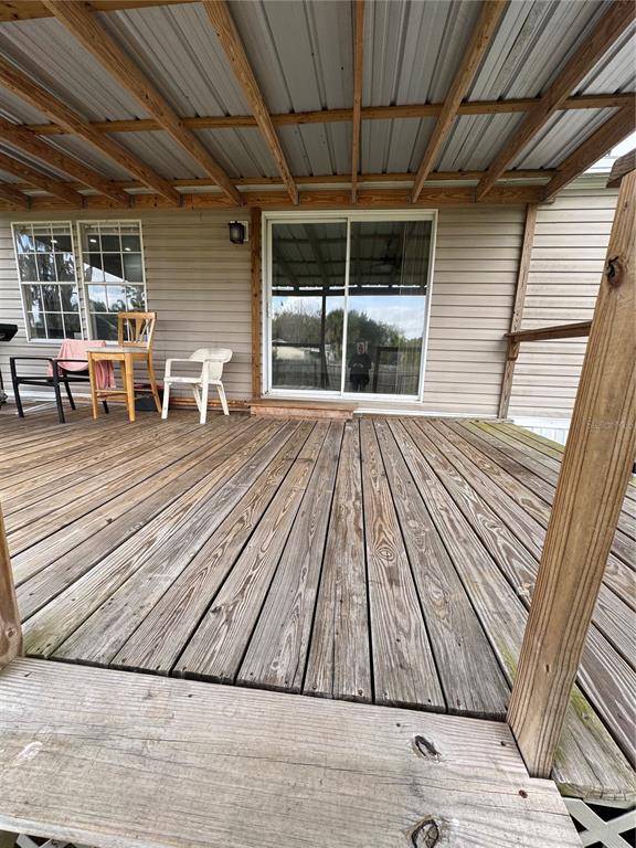 18806 Monroe Avenue Orlando, FL 32820 - Photo 15 of 44 a view of outdoor space with wooden floor and seating
