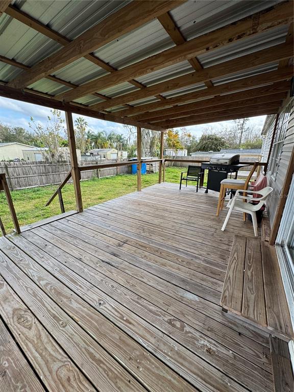18806 Monroe Avenue Orlando, FL 32820 - Photo 20 of 44 a view of a patio with wooden floor