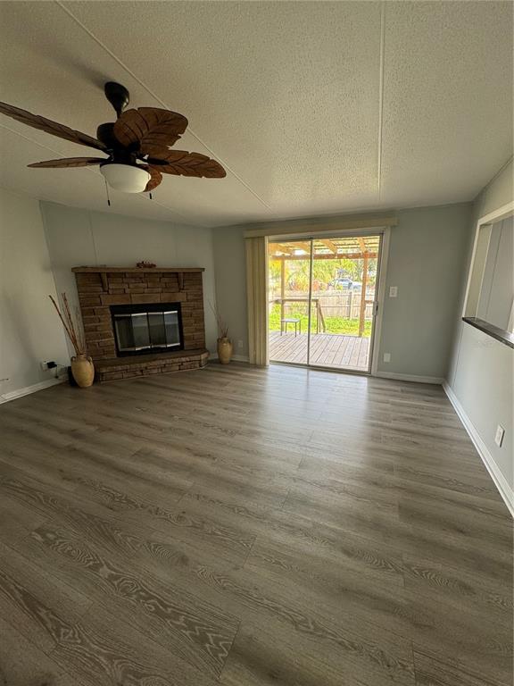 18806 Monroe Avenue Orlando, FL 32820 - Photo 26 of 44 an empty room with wooden floor and windows