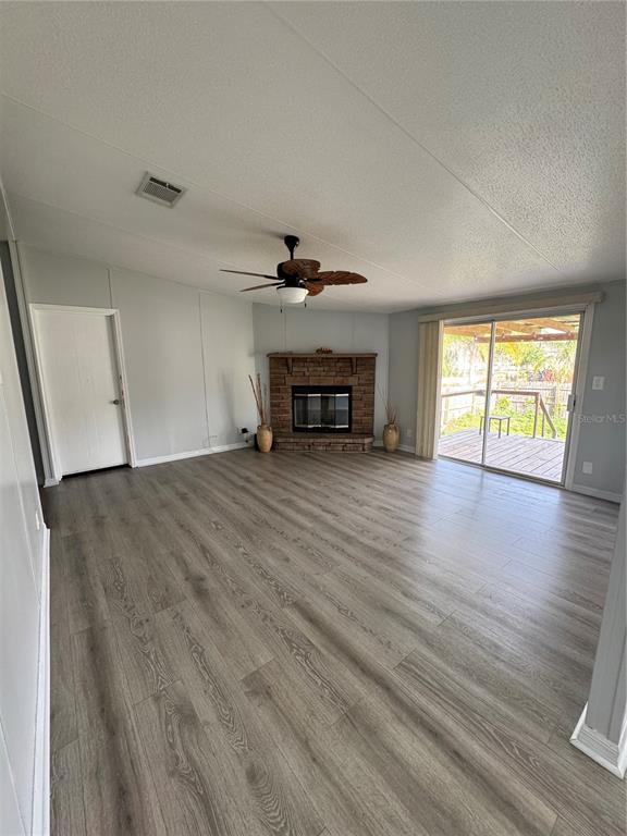 18806 Monroe Avenue Orlando, FL 32820 - Photo 27 of 44 wooden floor in an empty room with a window