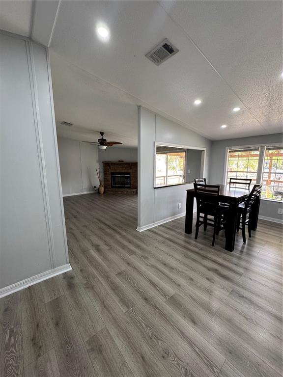 18806 Monroe Avenue Orlando, FL 32820 - Photo 29 of 44 a view of a dining room with furniture and wooden floor