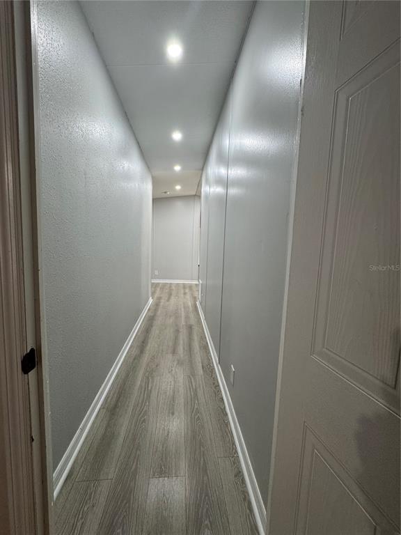 18806 Monroe Avenue Orlando, FL 32820 - Photo 31 of 44 a view of hallway with wooden floor