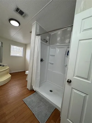 a bathroom with a double vanity sink and mirror