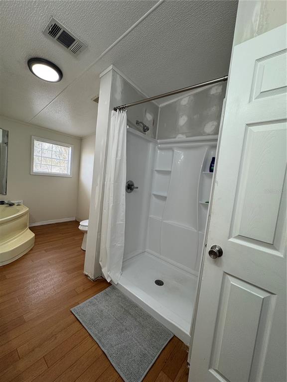 18806 Monroe Avenue Orlando, FL 32820 - Photo 38 of 44 a bathroom with a shower