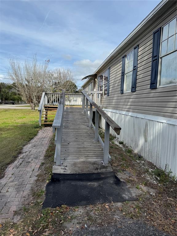 18806 Monroe Avenue Orlando, FL 32820 - Photo 10 of 44 a view of a backyard with pathway