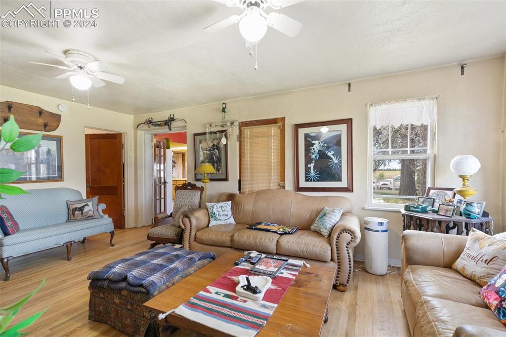 40150 Rapp Road Rush, CO 80833 - Photo 7 of 39 a living room with furniture and wooden floor