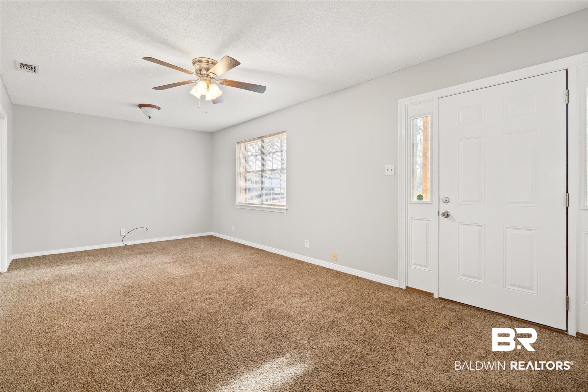 6848 Sandra Drive Theodore, AL 36582 - Photo 16 of 21 Carpeted foyer entrance featuring ceiling fan