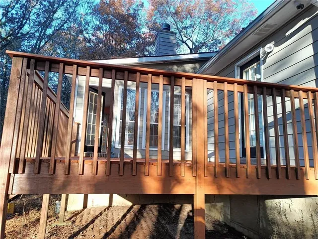 a view of outdoor space with deck and furniture