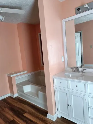 a bathroom with a sink and mirror