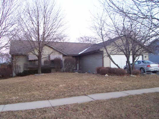 3191 North Trainer Road Rockford, IL 61114 - Photo 1 of 1 a view of a house with a yard covered with snow in front of house
