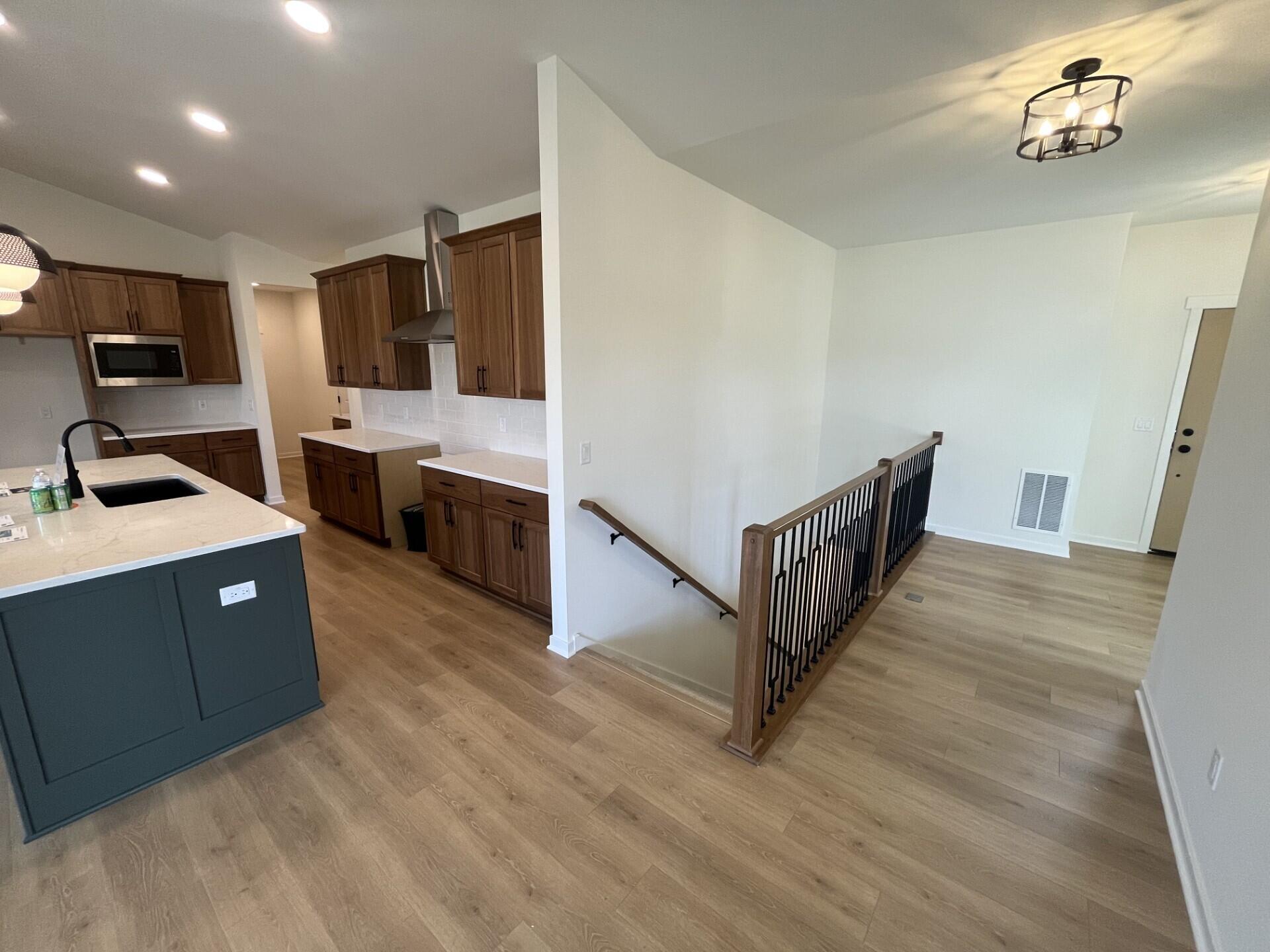 438 Sandstone Street Slinger, WI 53086 - Photo 3 of 8 Front Foyer & Staircase to LL
