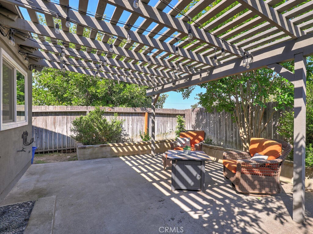 22661 Claude Circle Lake Forest, CA 92630 - Photo 23 of 50 a view of a patio with table and chairs and wooden fence with plants