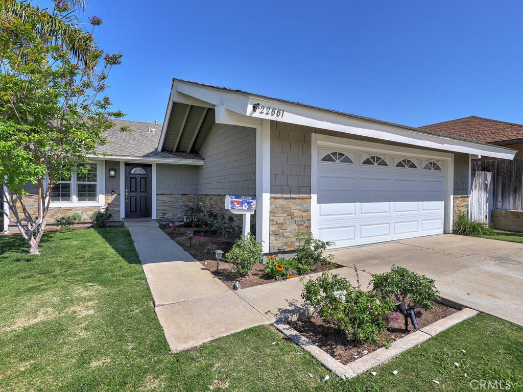 22661 Claude Circle Lake Forest, CA 92630 - Photo 3 of 50 front view of a house with a yard