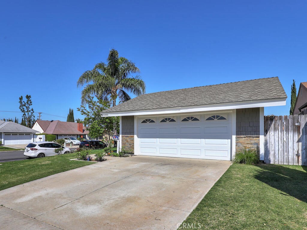 22661 Claude Circle Lake Forest, CA 92630 - Photo 34 of 50 a front view of house with yard