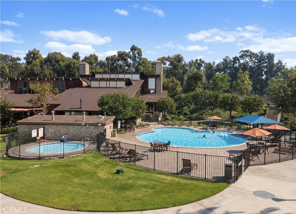 22661 Claude Circle Lake Forest, CA 92630 - Photo 37 of 50 a view of a swimming pool with a patio