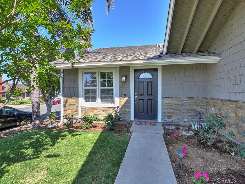 22661 Claude Circle Lake Forest, CA 92630 - Photo 4 of 50 a front view of a house with a porch