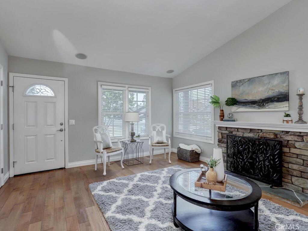 22661 Claude Circle Lake Forest, CA 92630 - Photo 5 of 50 a living room with furniture and a fireplace