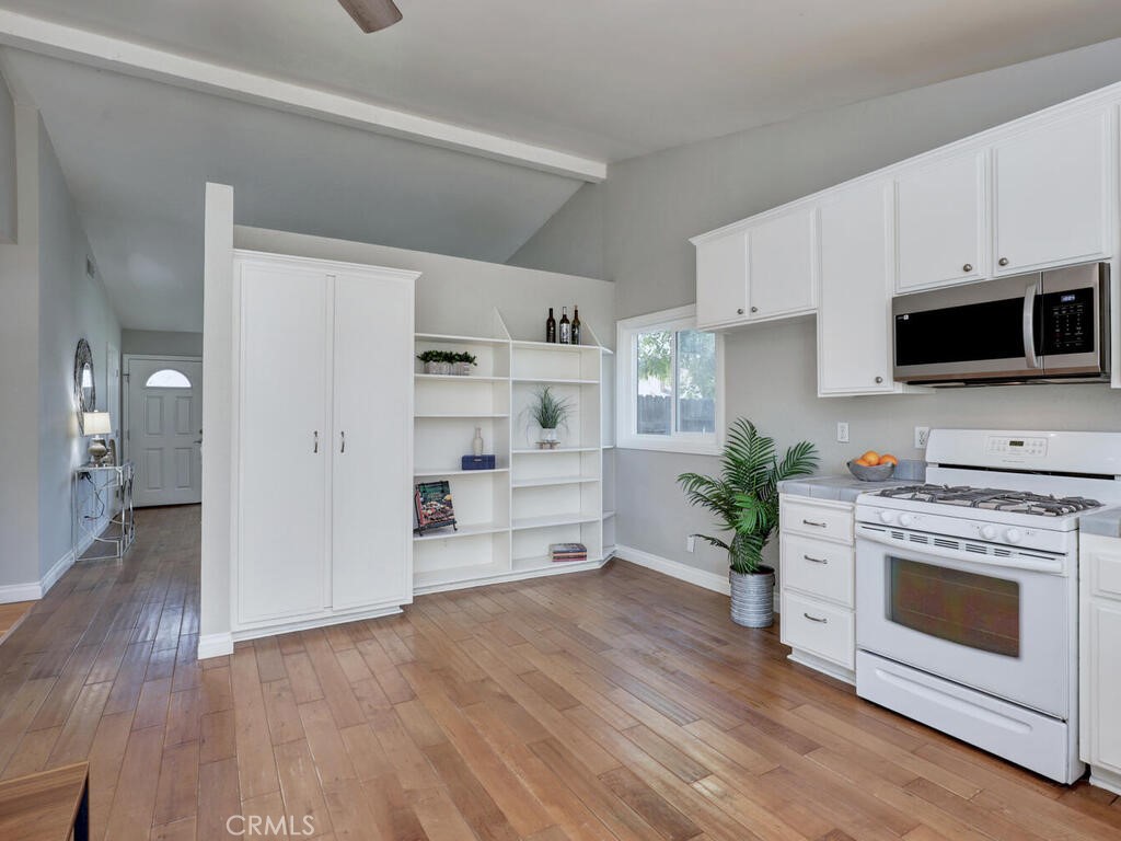 22661 Claude Circle Lake Forest, CA 92630 - Photo 8 of 50 a living room with furniture and a fireplace