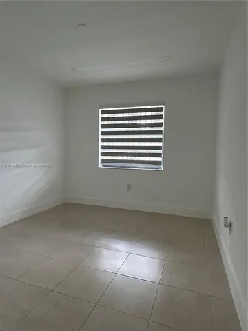 a bathroom with a toilet and a bathtub