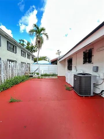 a view of lobby with furniture and a chandelier
