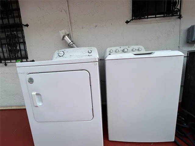 a utility room with dryer and washer