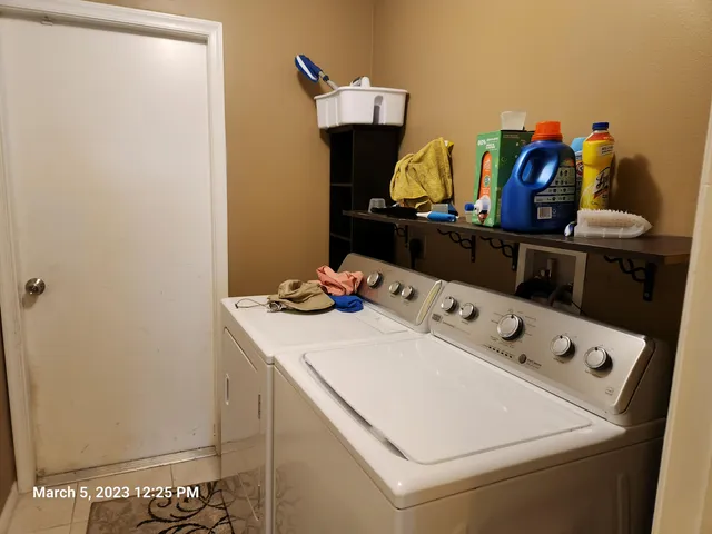 a utility room with dryer and washer