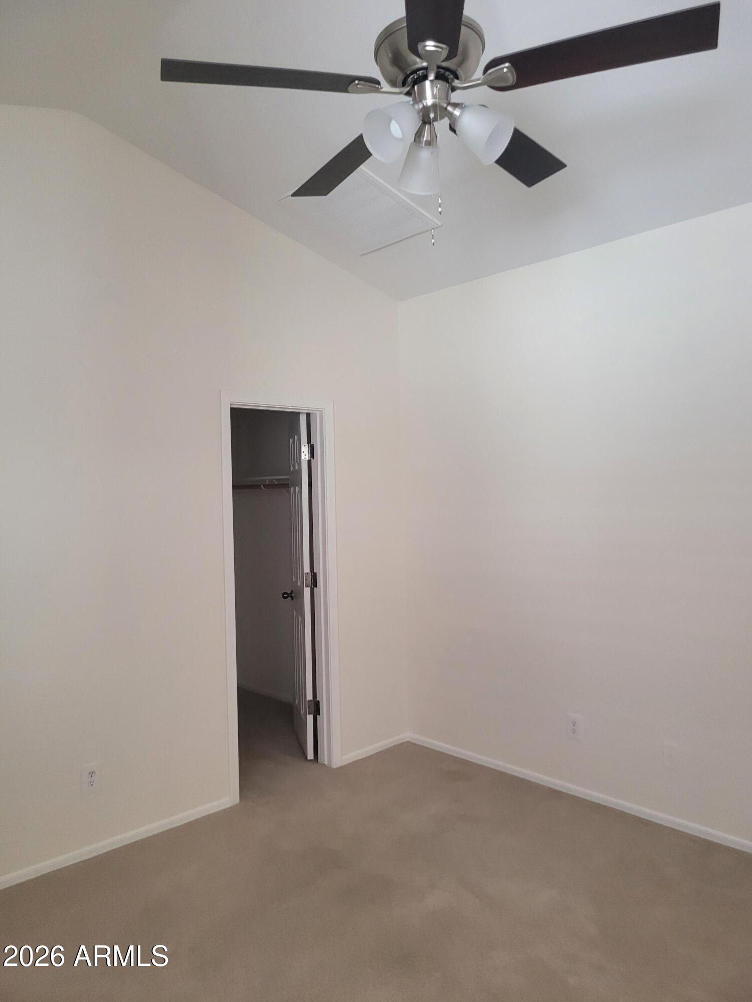 1453 South Sinova Avenue Gilbert, AZ 85296 - Photo 23 of 46 an empty room with a ceiling fan and a fan