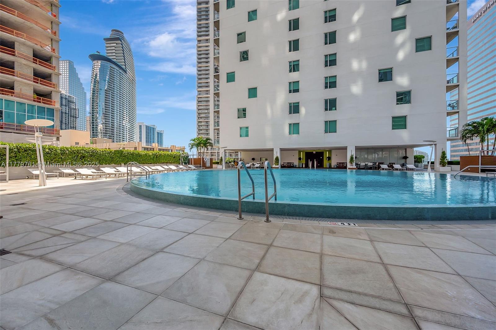 Brickell Miami, FL 33131 - Photo 39 of 52 a view of a building with backyard and trees