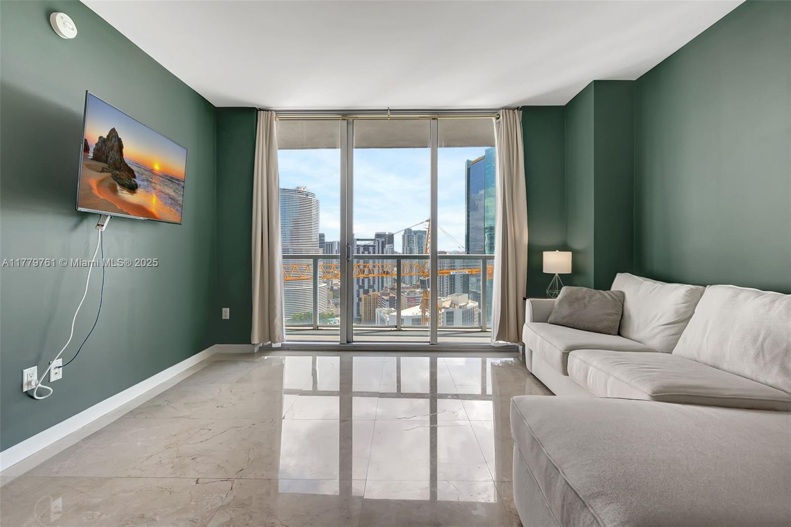 Brickell Miami, FL 33131 - Photo 6 of 52 a living room with furniture and a large window