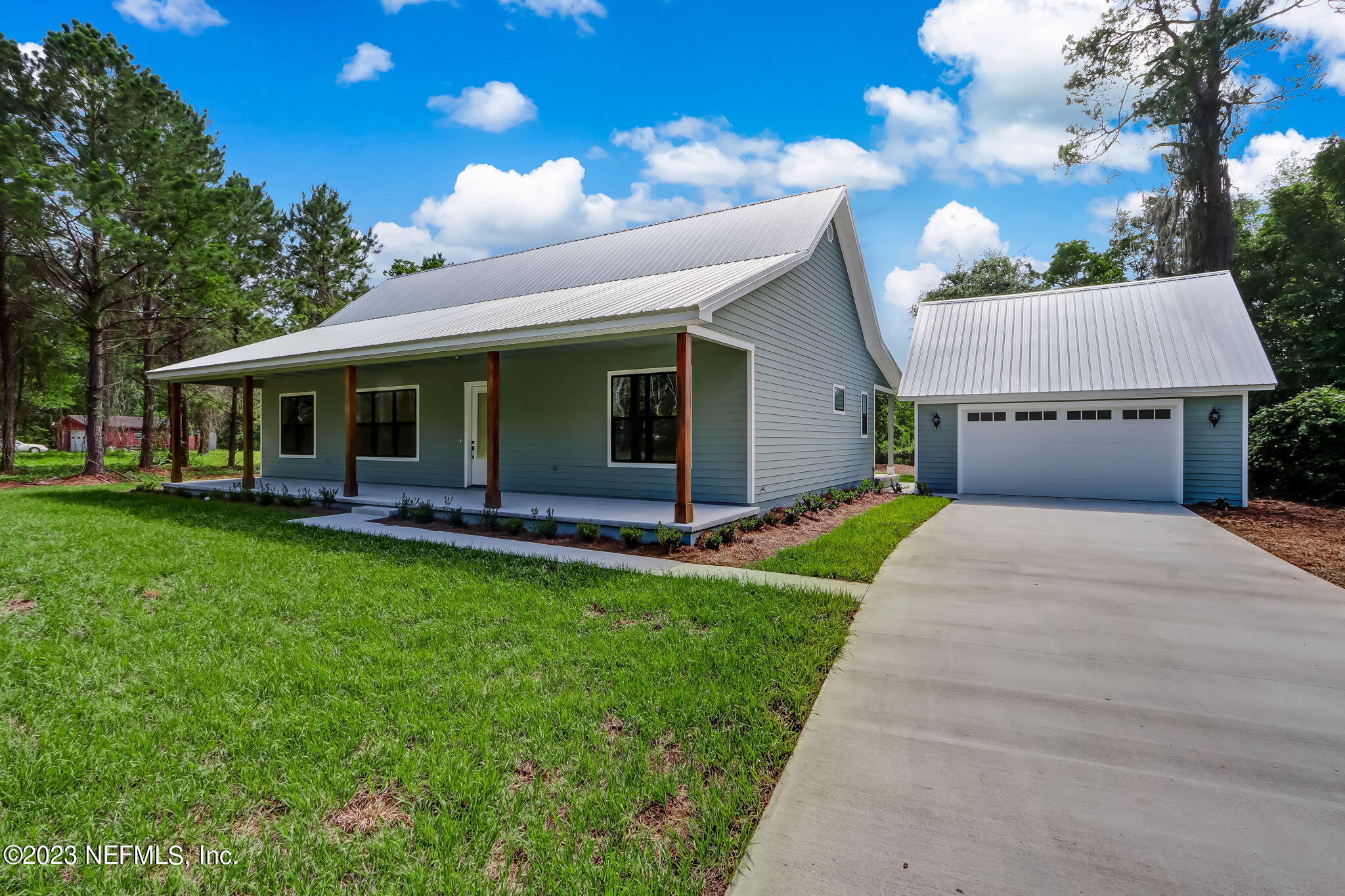 86277 Peeples Road Yulee, FL 32097 - Photo 1 of 36 a front view of house with yard and green space
