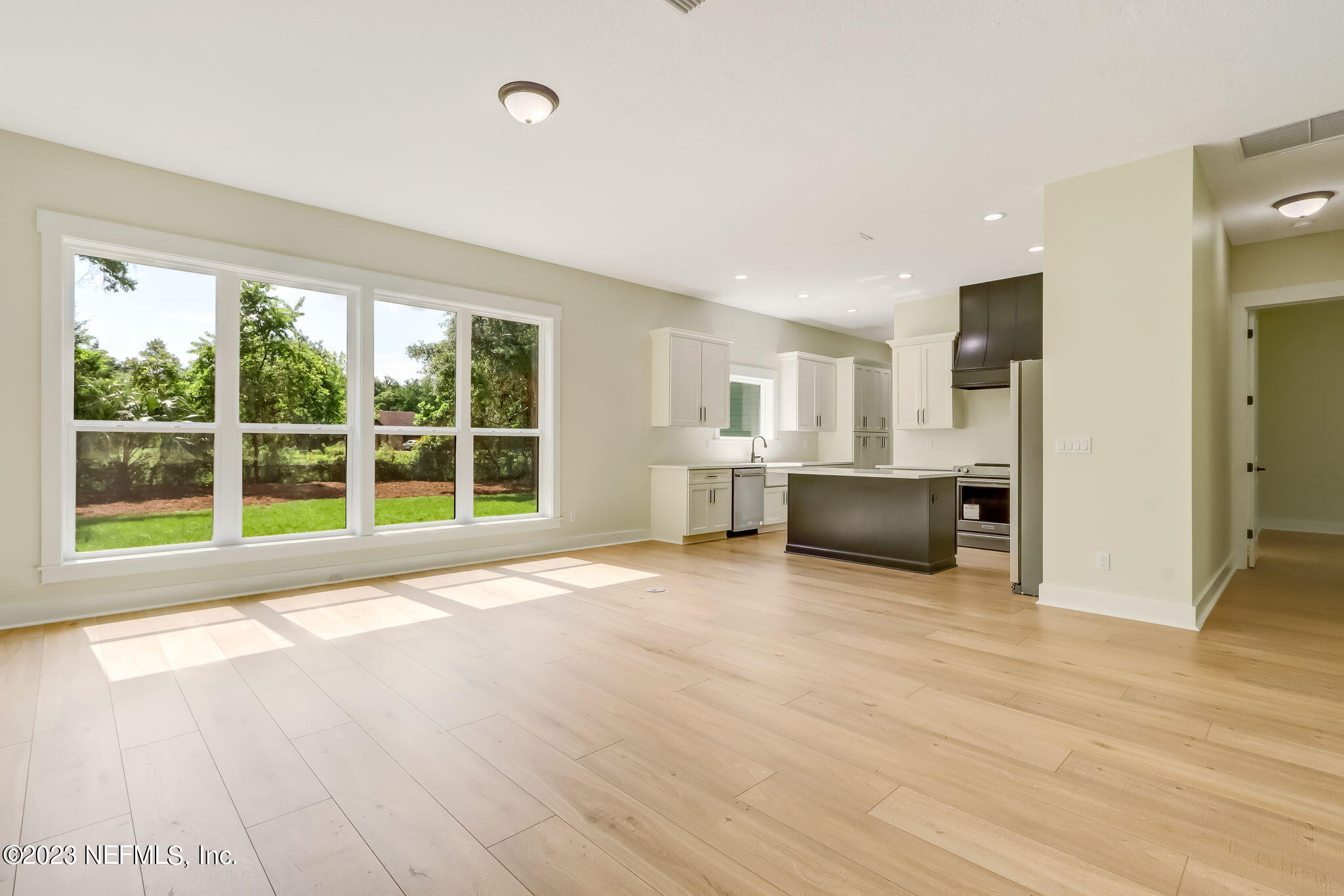 86277 Peeples Road Yulee, FL 32097 - Photo 12 of 36 a view of an empty room with a window and kitchen view