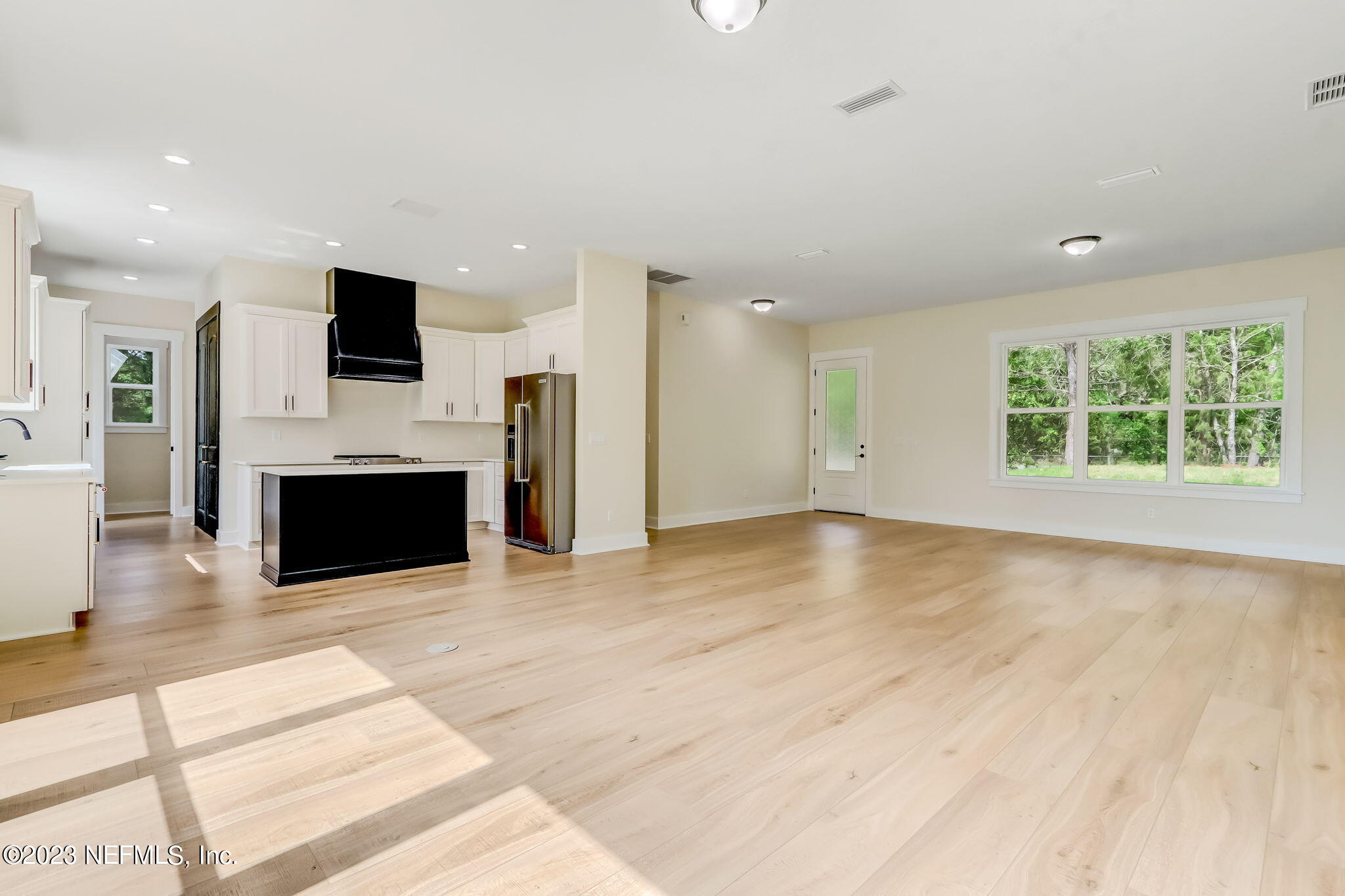 86277 Peeples Road Yulee, FL 32097 - Photo 13 of 36 a view of a kitchen with a sink and a fireplace