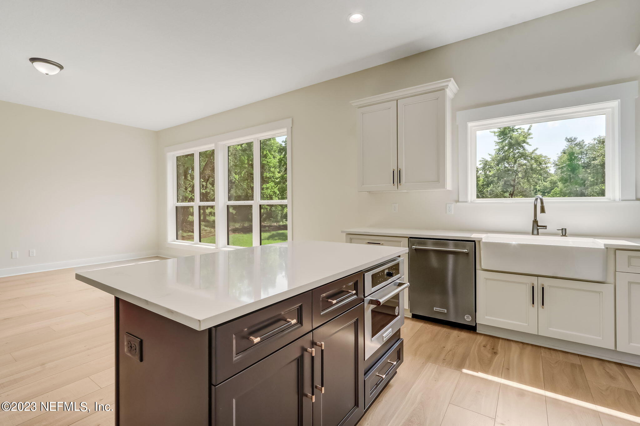 86277 Peeples Road Yulee, FL 32097 - Photo 17 of 36 a kitchen with a sink stove and cabinets