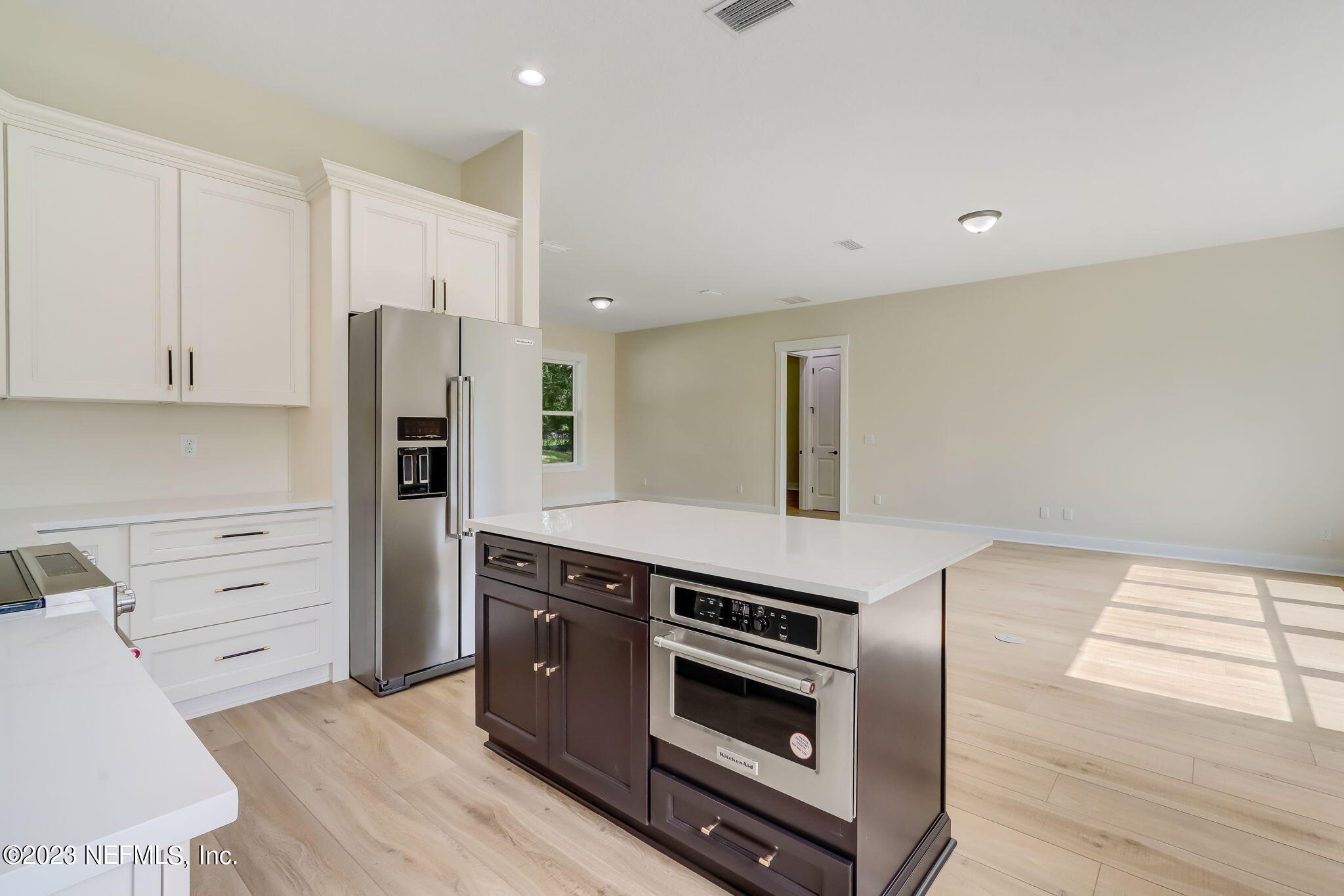 86277 Peeples Road Yulee, FL 32097 - Photo 18 of 36 a kitchen with stainless steel appliances a stove and a refrigerator