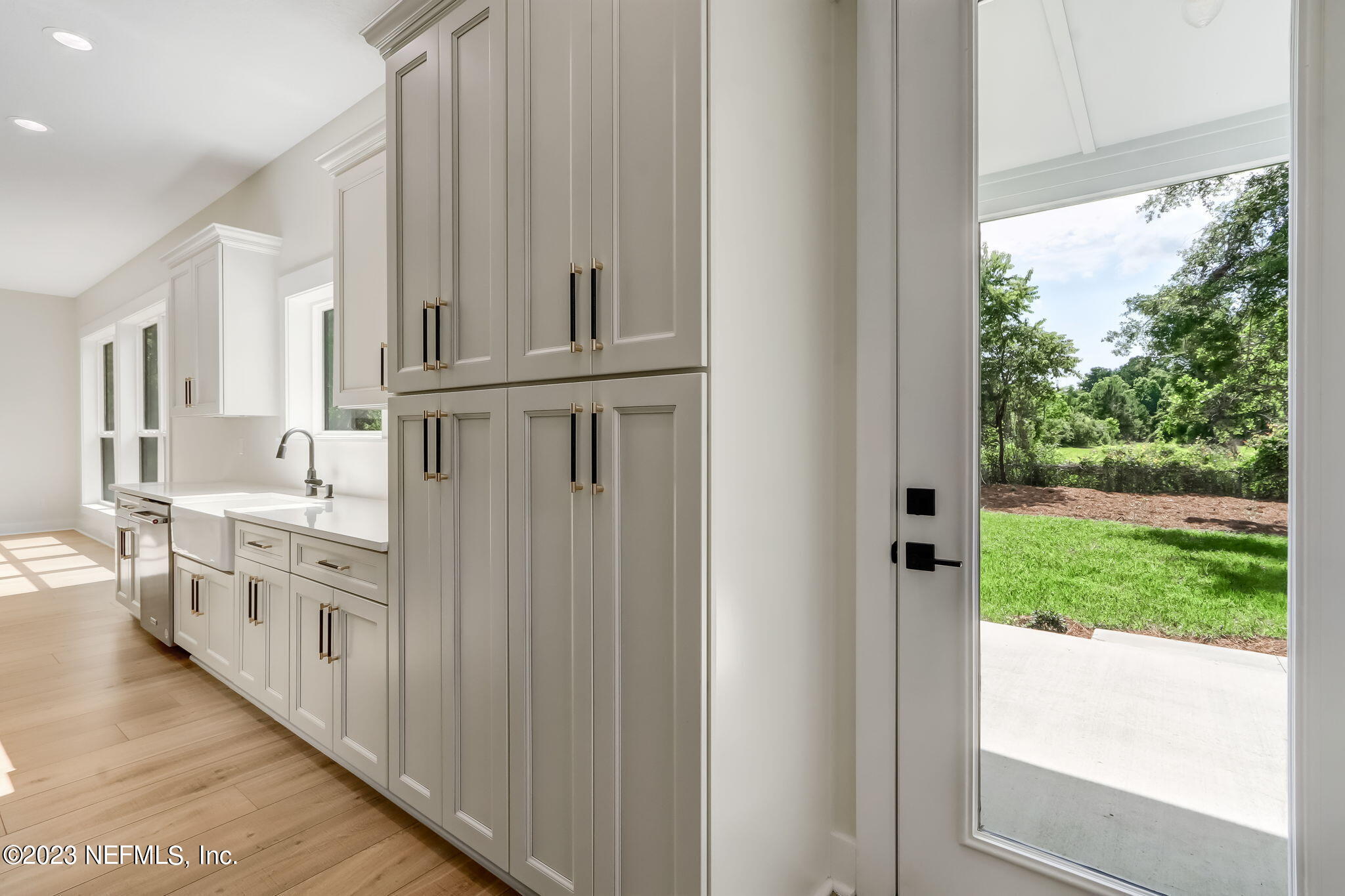 86277 Peeples Road Yulee, FL 32097 - Photo 19 of 36 a kitchen with stainless steel appliances granite countertop a refrigerator and a sink