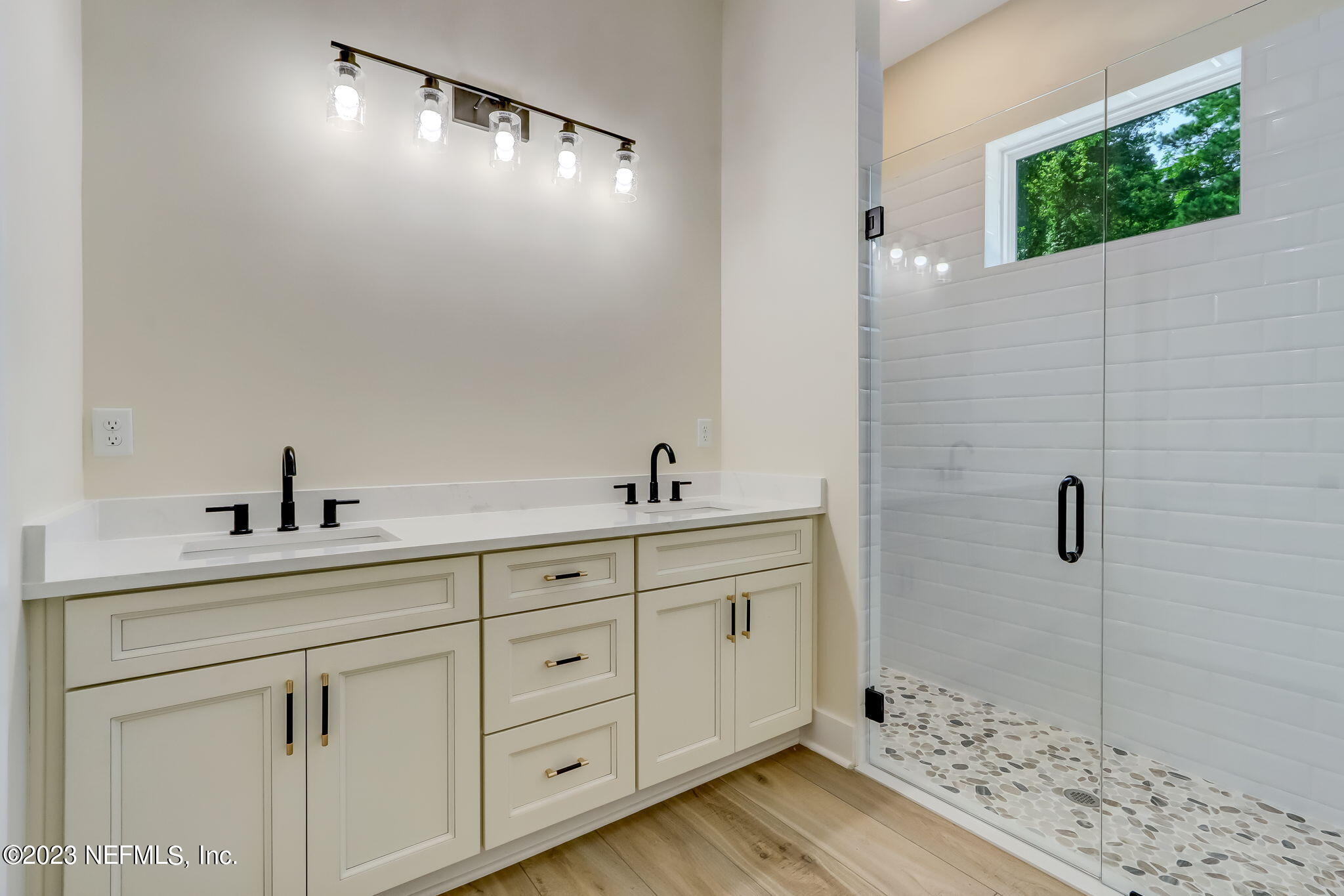 86277 Peeples Road Yulee, FL 32097 - Photo 25 of 36 a spacious bathroom with double sink and a mirror