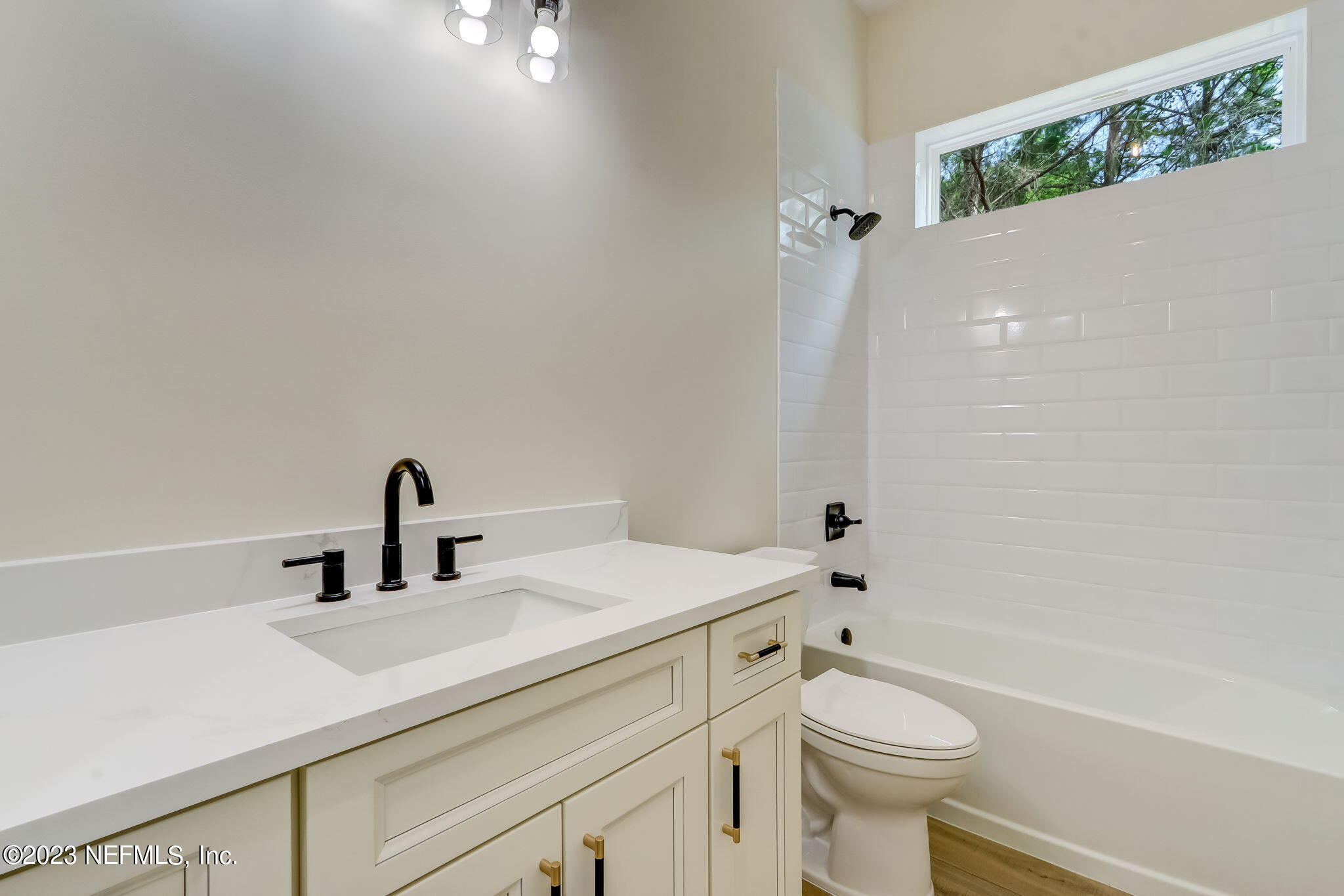 86277 Peeples Road Yulee, FL 32097 - Photo 28 of 36 a bathroom with a sink a toilet and shower