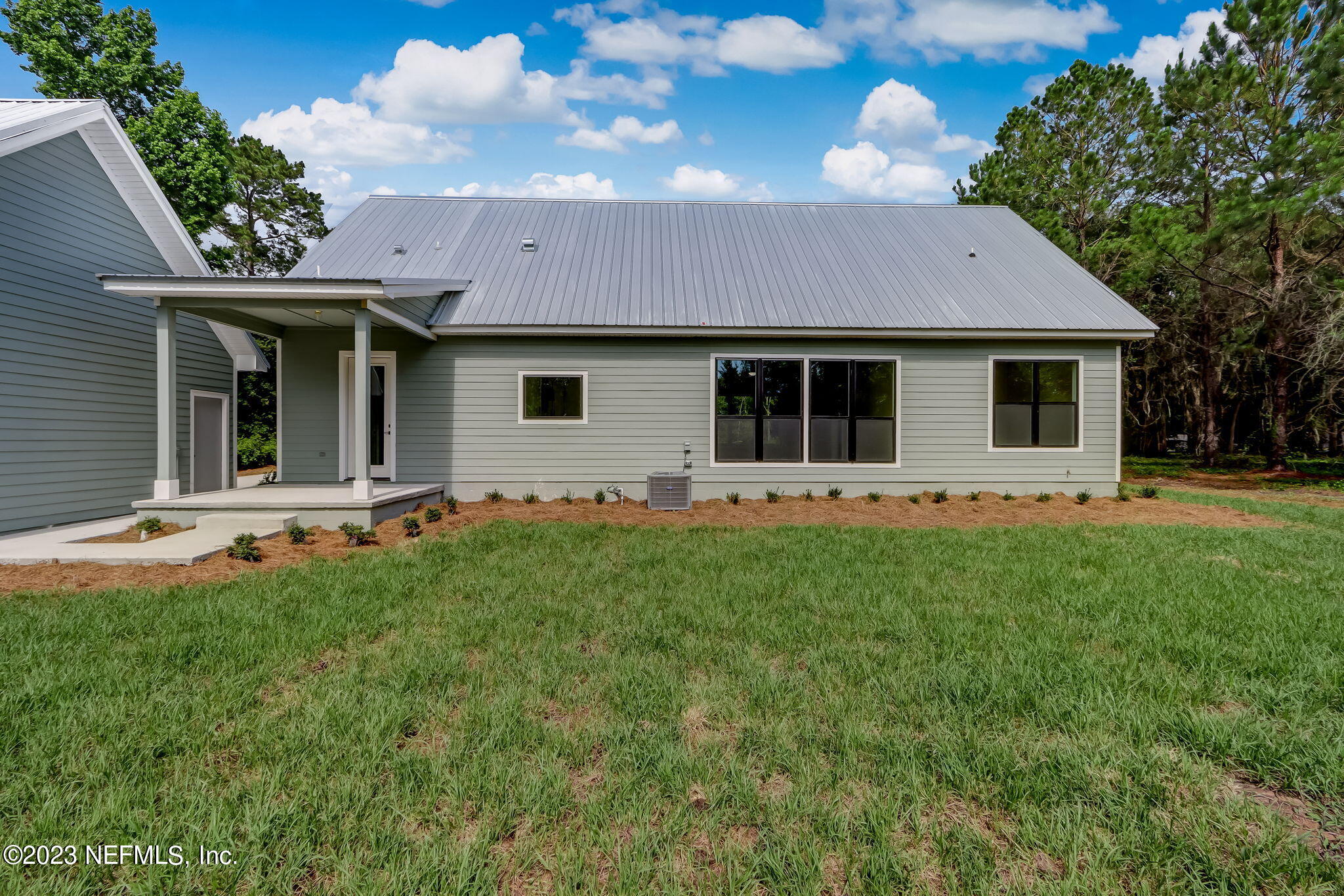 86277 Peeples Road Yulee, FL 32097 - Photo 32 of 36 a front view of a house with a yard