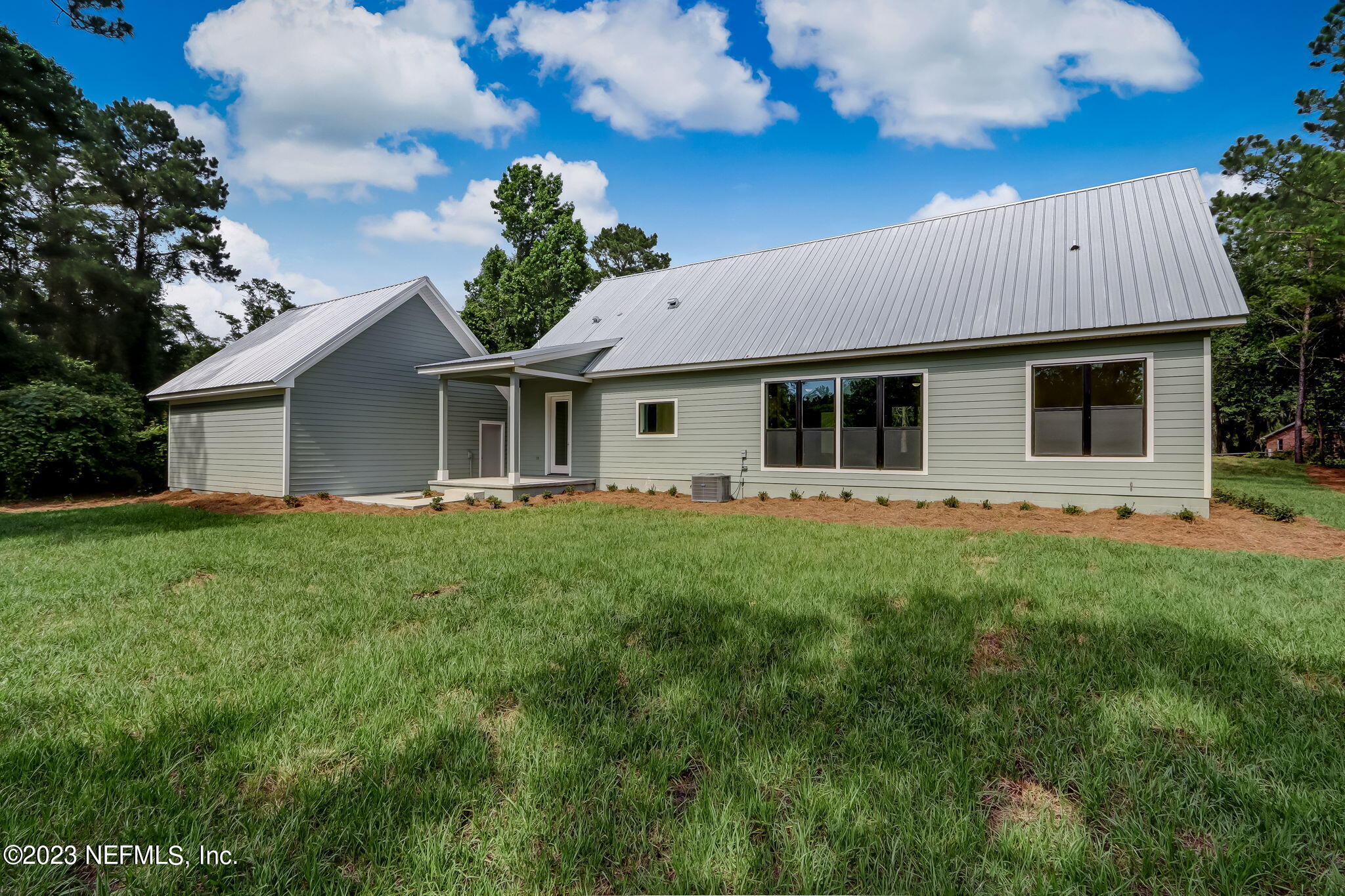 86277 Peeples Road Yulee, FL 32097 - Photo 33 of 36 a view of a house with a backyard