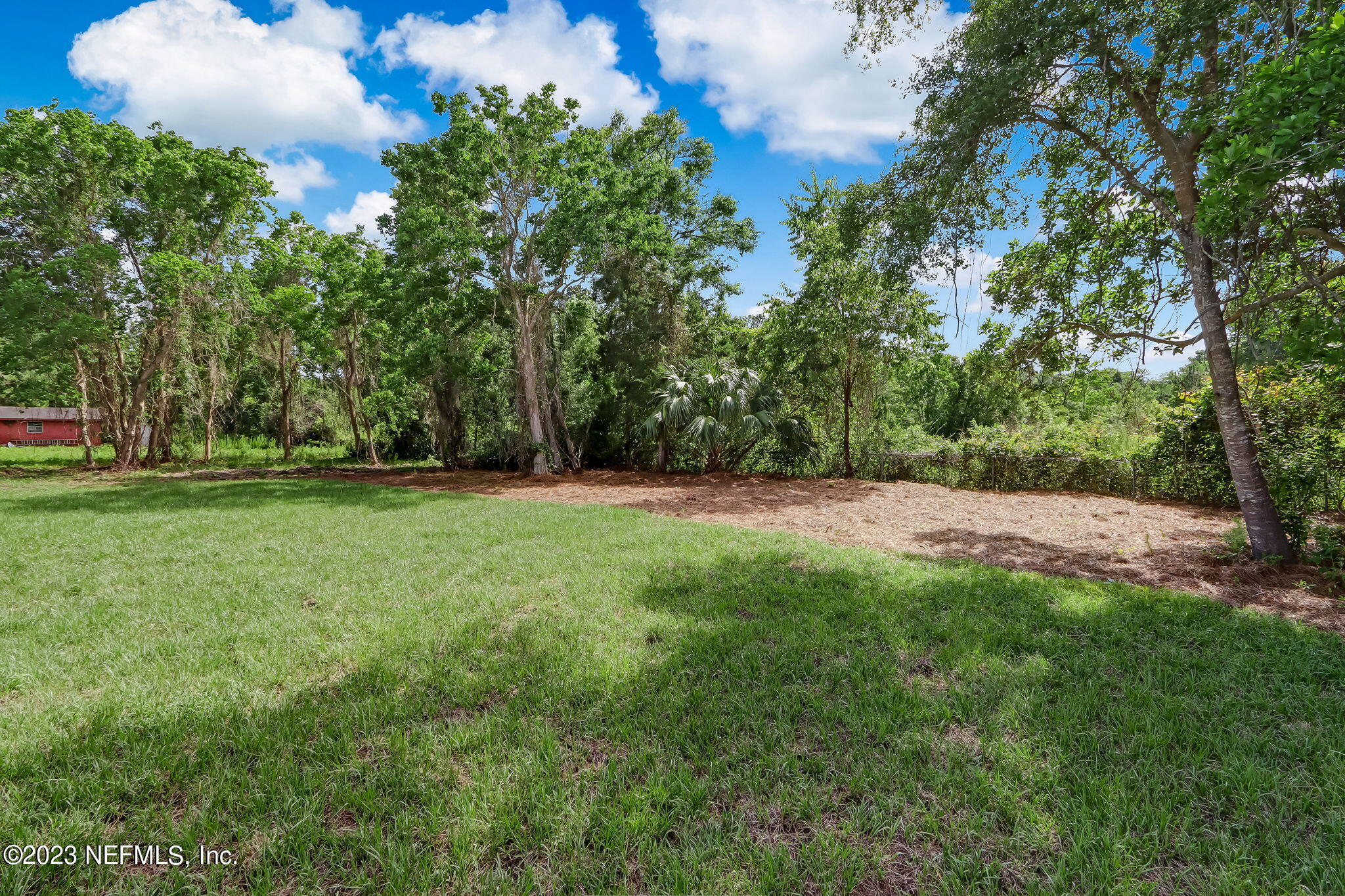 86277 Peeples Road Yulee, FL 32097 - Photo 35 of 36 a view of a field with trees in the background