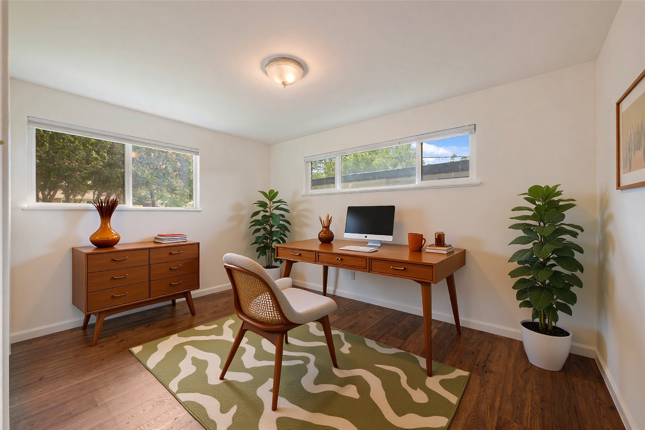 4602 Frontier Trail Austin, TX 78745 - Photo 12 of 21 A quiet room, perfectly suited for a dedicated workspace, features gleaming hardwood floors and ample natural light.