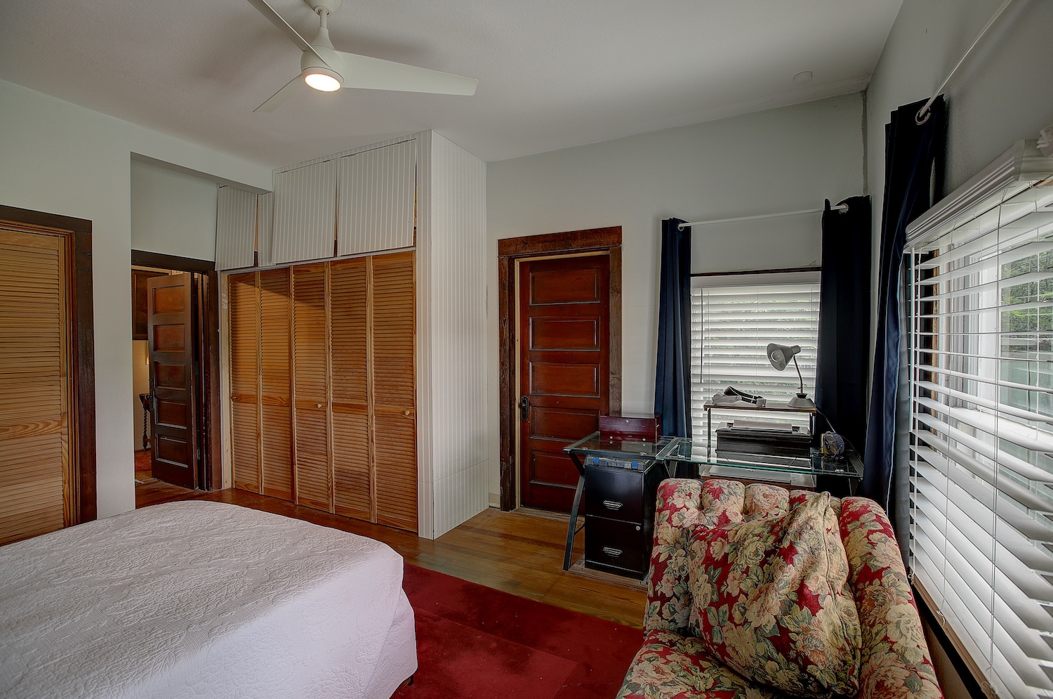 1903 South Austin Avenue Georgetown, TX 78626 - Photo 30 of 40 Bedroom # 2 does double duty as an office and a bedroom/guest room. 2 large closets for storage. tall ceilings, a door to the outside, and windows on 3 walls. :) My goodness the natural light is amazin