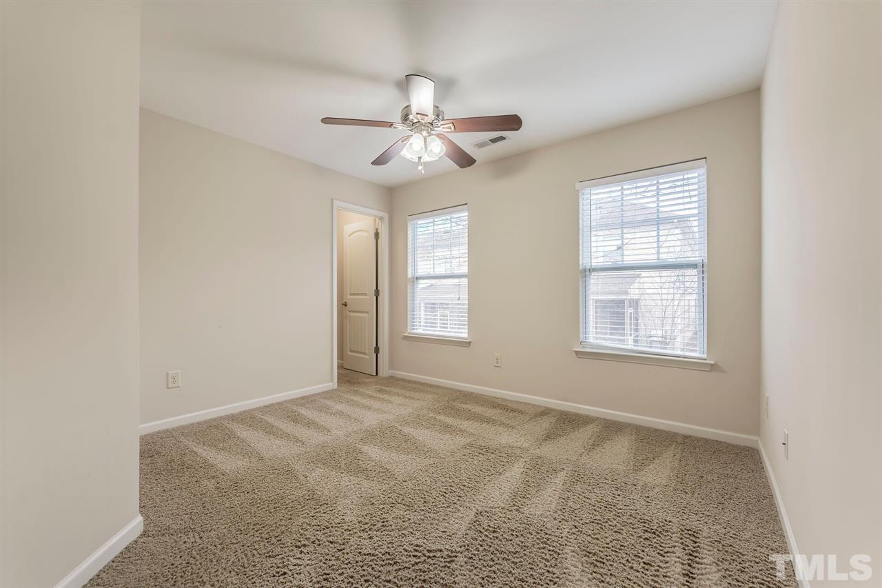 2431 Swans Rest Way Raleigh, NC 27606 - Photo 19 of 25 a view of an empty room with a window