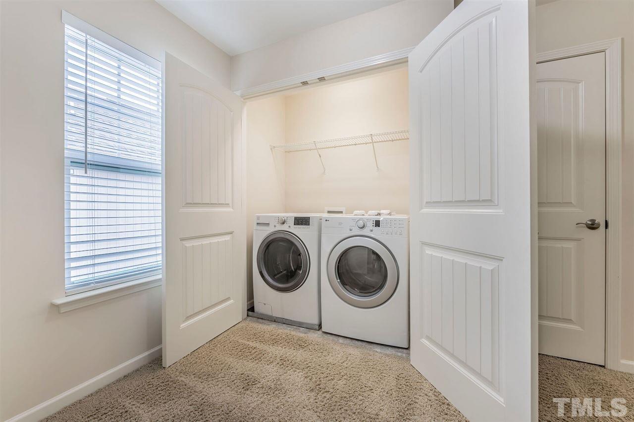 2431 Swans Rest Way Raleigh, NC 27606 - Photo 21 of 25 a utility room with dryer and washer