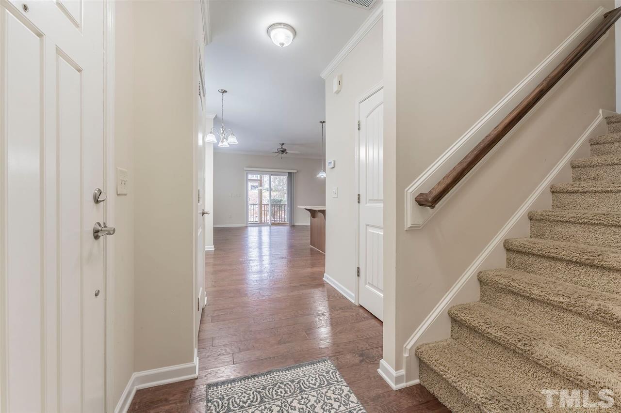 2431 Swans Rest Way Raleigh, NC 27606 - Photo 4 of 25 a view of entryway and hall with wooden floor
