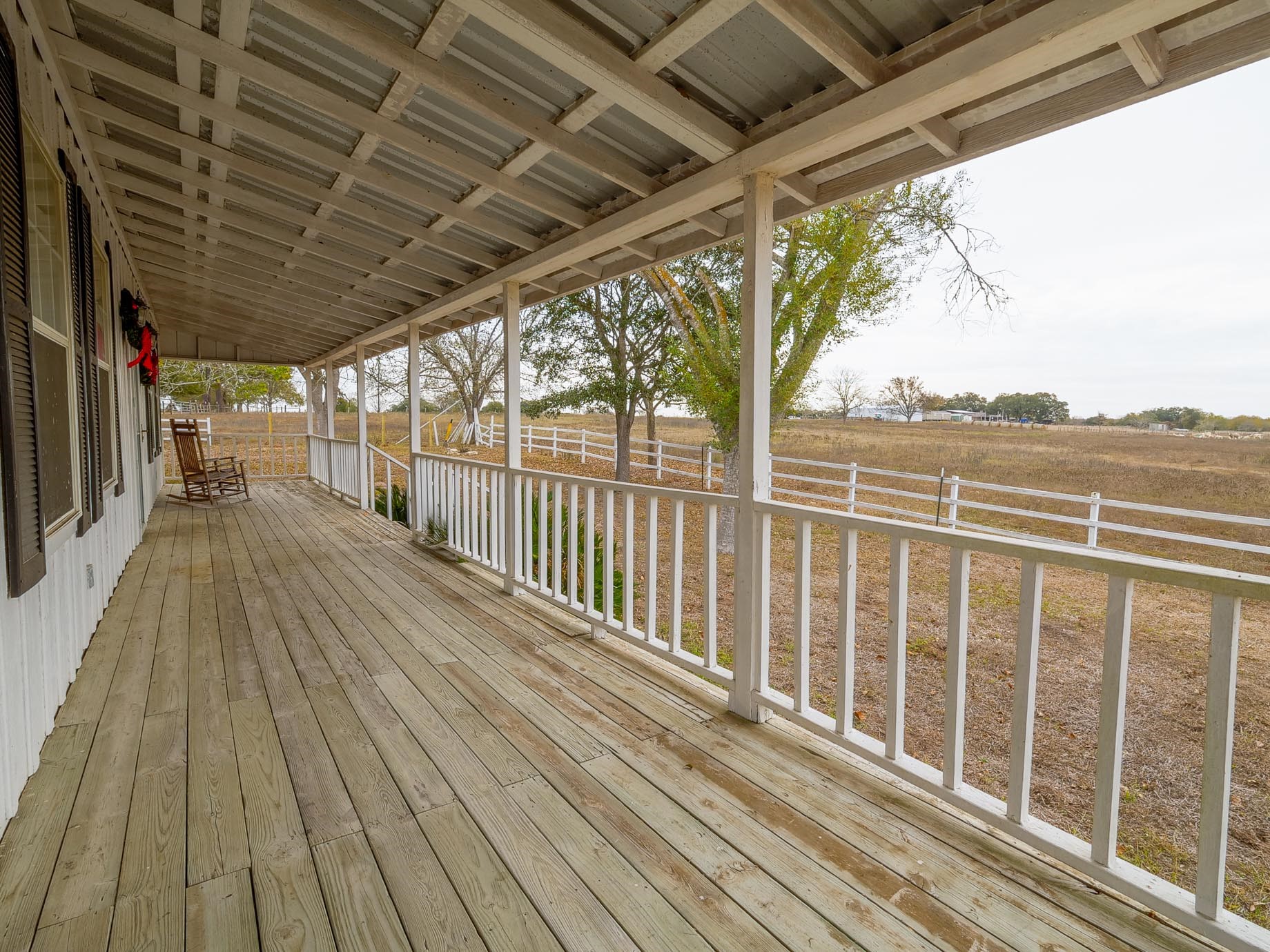 1505 Prairie Valley Road West Point, TX 78963 - Photo 21 of 34 a view of a balcony with wooden floor