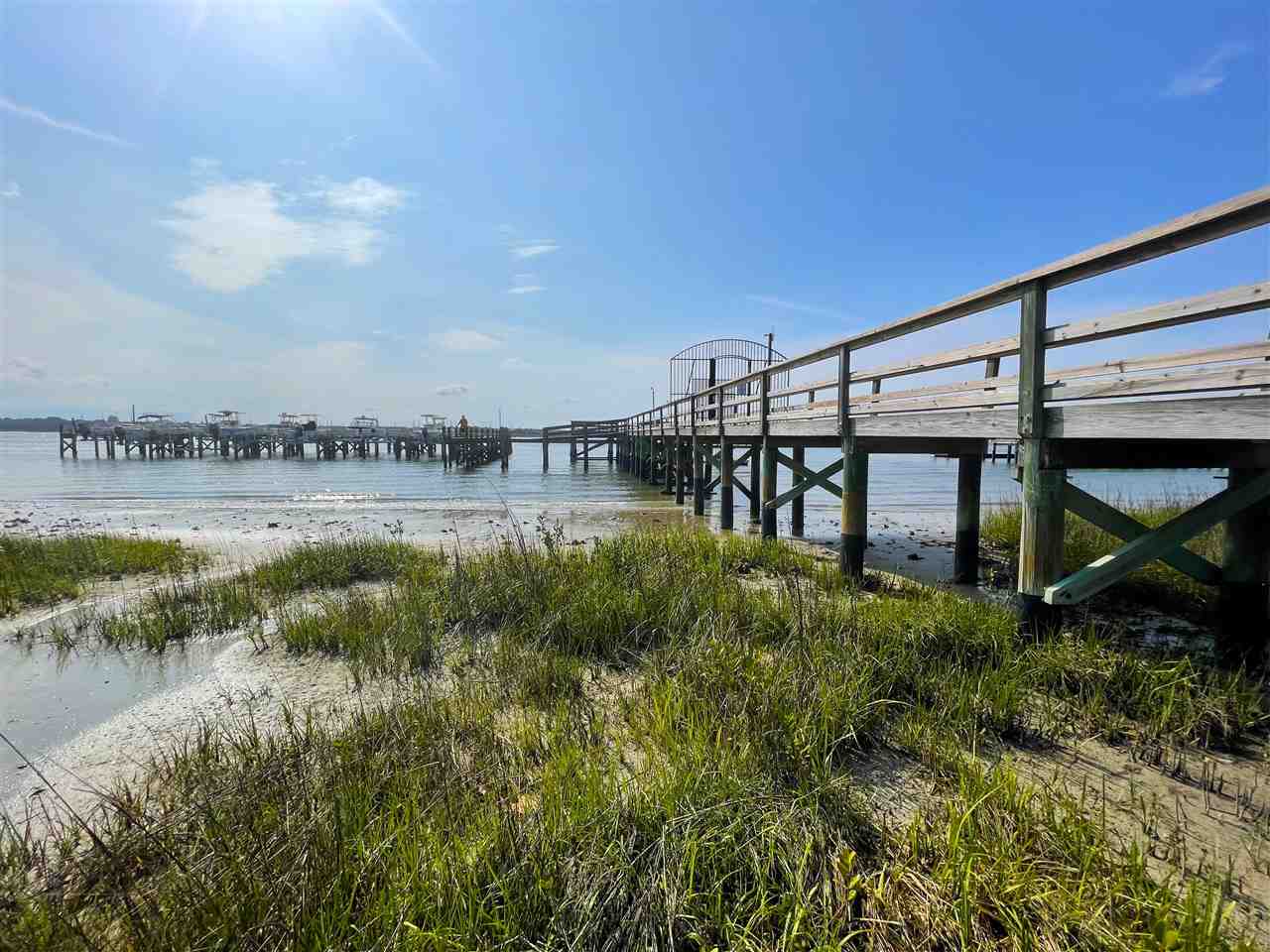 Lot 2 Pelican Reef Drive St. Augustine, FL 32080 - Photo 3 of 5 a view of a lake with a yard and large trees
